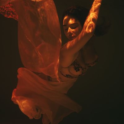 Abstract shot of flowing fabric or water, symbolizing movement.