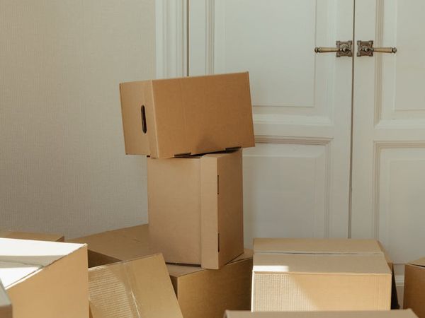 Person moving gracefully through a sequence of exercises in a bright, clean space.